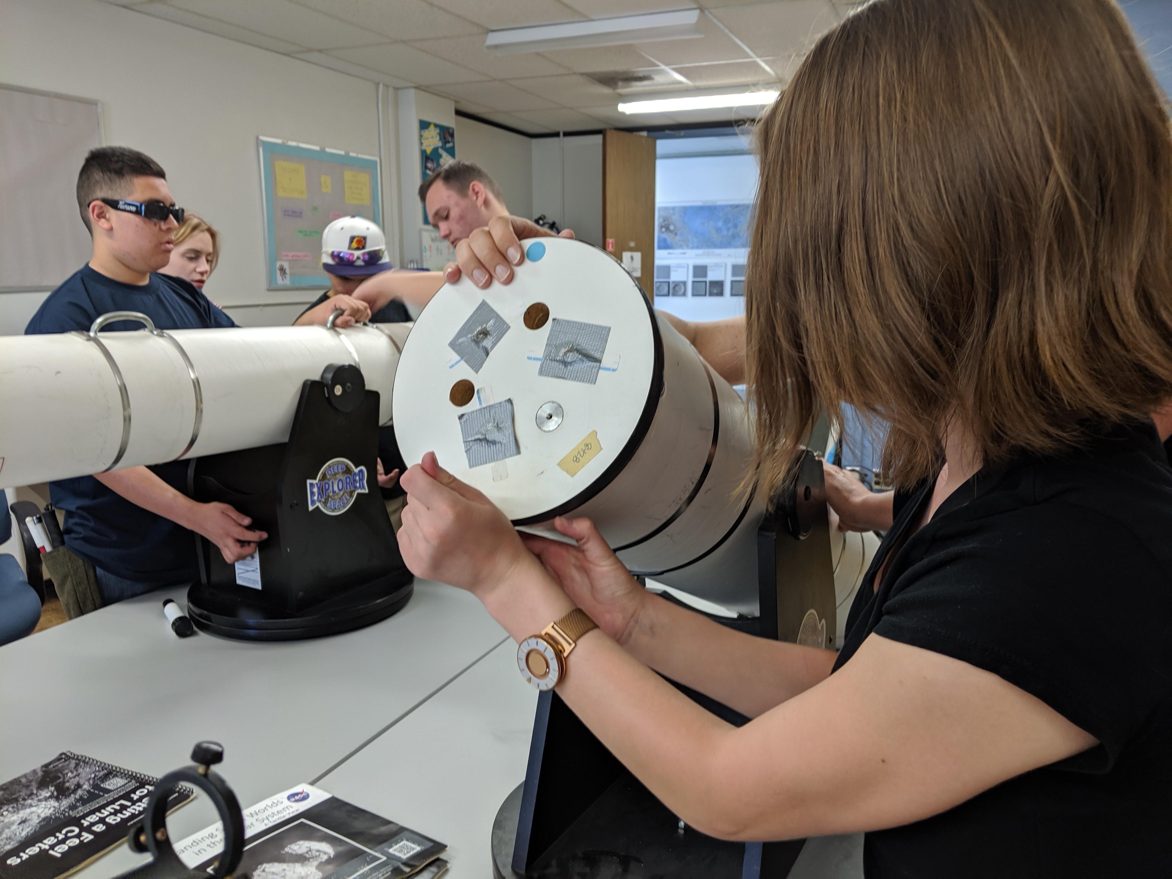 Project POEM students learn about the parts of a telescope. They are able to take it apart and examine how the telescope is assembled.